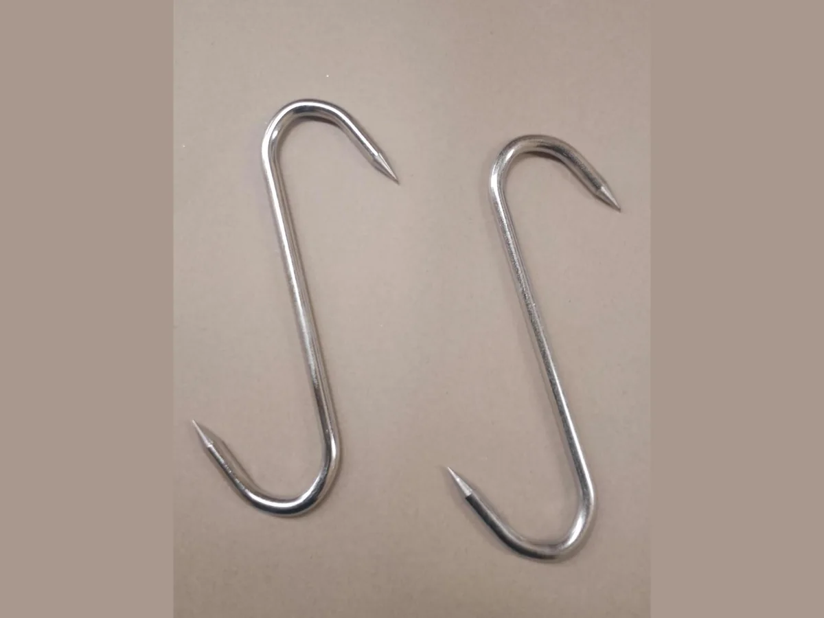 Stainless Steel Hooks Pair of polished stainless steel S-shaped butchery meat hooks with pointed ends