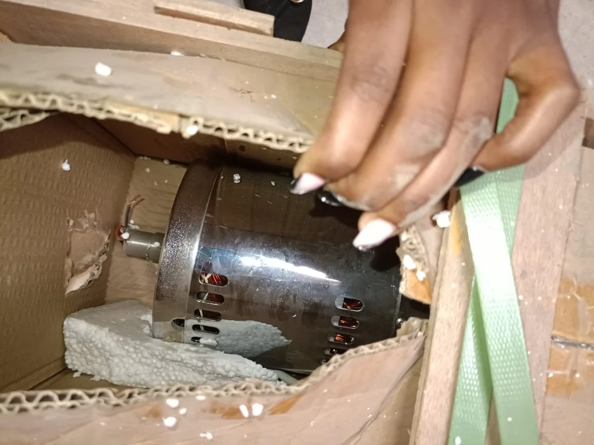 Mortar Bonesaw Bone saw electric motor in its packing box, showing the vented stainless steel housing